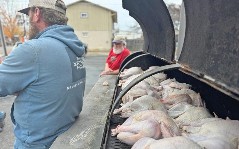 (MIKE SIPES | CONTRIBUTED PHOTO) Young County Masonic Lodge pitmaster Johnathan Southerland and Lodge Worshipful Master Doug Magneson discuss plans to cook turkeys for the community during the Mason’s Turkey Smoke.