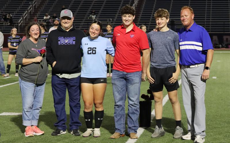 (THOMAS WALLNER | THE GRAHAM LEADER) Taylor Lauster is honored during senior night with her family.