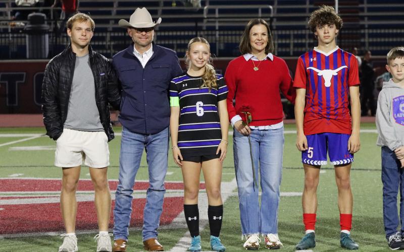 (THOMAS WALLNER | THE GRAHAM LEADER) Ellie Weatherman is honored during senior night with her family.