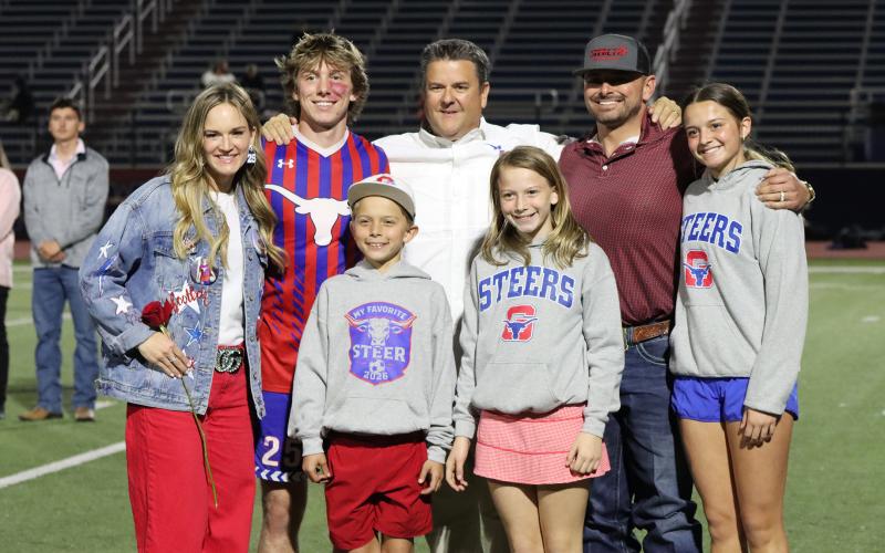 (THOMAS WALLNER | THE GRAHAM LEADER) Jace Gill is honored during senior night with his family.