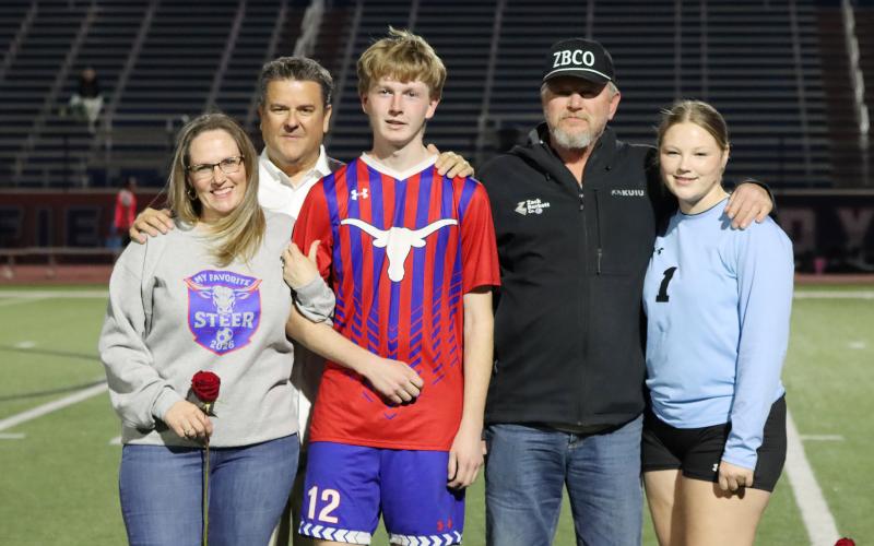 (THOMAS WALLNER | THE GRAHAM LEADER) Jacob Collins is honored during senior night with his family.