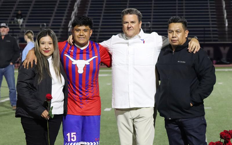 (THOMAS WALLNER | THE GRAHAM LEADER) Saul Ramos is honored during senior night with his family.