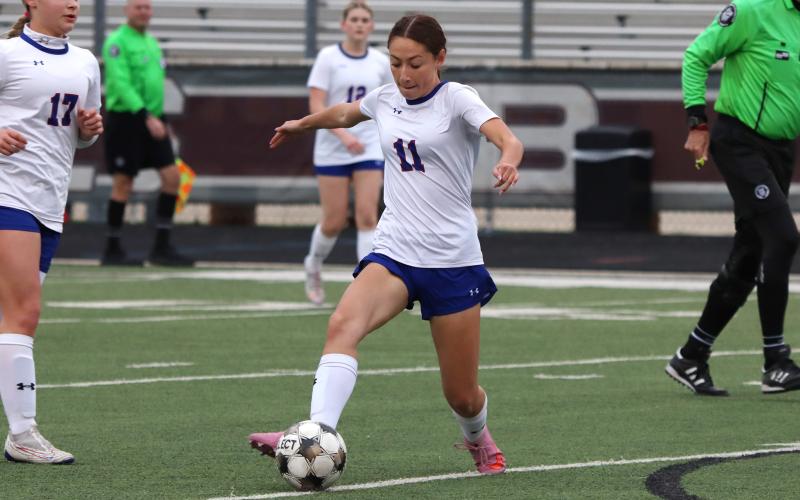 (KYLIE BAILEY | THE GRAHAM LEADER) Marrisa Bueno handles the ball Friday, Feb. 20 against the Bridgeport Lady Bulls. Bueno was a key contributor in the Lady Blues 3-0 victory. 