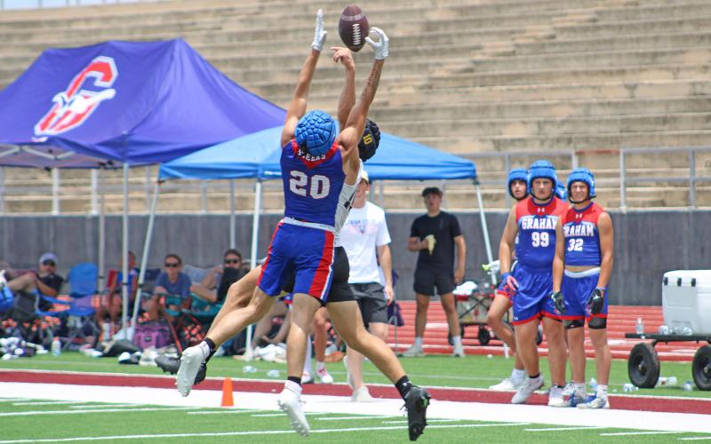 (ALEX HAVARDANSKY | THE GRAHAM LEADER) Jordan Alexander goes up against a Gatesville receiver for an interception Saturday, May 31. Alexander’s pick was arguably game sealing in the match as it halted a potential tying scoring drive for the Hornets.