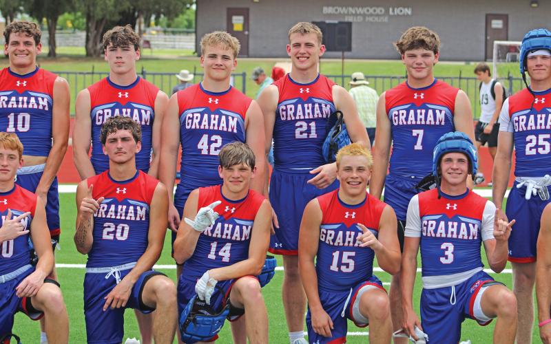 (ALEX HAVARDANSKY | THE GRAHAM LEADER) A portion of the Steers 7on7 team pose for a victory photo Saturday, May 31 after a 7on7 tournament. The Steers won all four of their matches in Brownwood and advanced to the state tournament. 