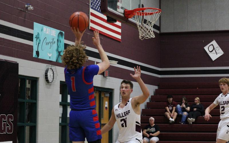 (ALEX HAVARDANKSY | THE GRAHAM LEADER) Tyler Allen attempts a midrange jumper Tuesday, Nov. 18 against the Millsap Bulldogs. Allen scored seven points in the Steers blowout win over the Millsap Bulldogs.