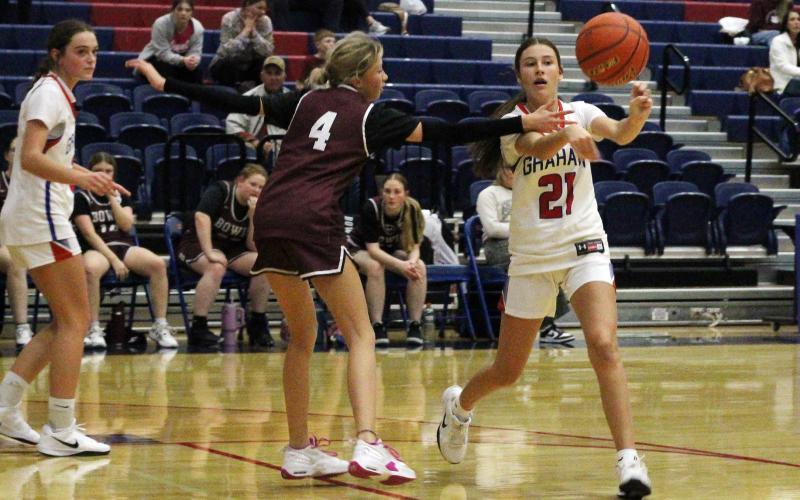 (ALEX HAVARDANSKY | THE GRAHAM LEADER) Addison Gober passes the ball to one of her teammates Thursday, Nov. 20 against the Bowie Lady Rabbits. Gober led the team in scoring in the Lady Blues 48-13 win. 