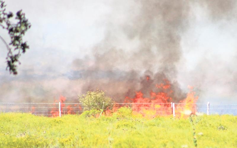 (TC GORDON | THE GRAHAM LEADER) Volunteer Fire Departments and other emergency personnel respond to a grass fire Wednesday, Oct. 9 on FM 61 south of Burch Road. Young County Commissioners voted to implement a burn ban which went into effect Tuesday, Oct. 15 and will expire in 90 days, unless commissioners remove it earlier.