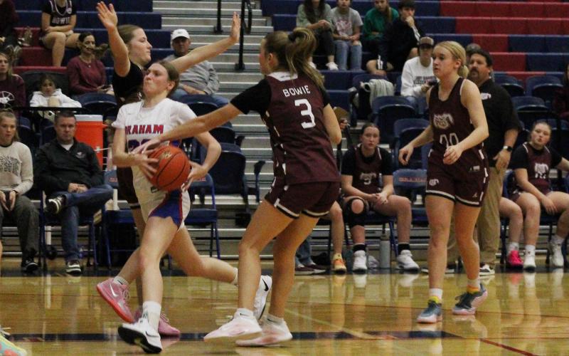 (ALEX HAVARDANSKY | THE GRAHAM LEADER) Katy McGehee drives past multiple defenders to get to the basket Thursday, Nov. 20 against the Bowie Ladyrabbits. McGehee helped lead the way in the fourth quarter comeback against the Bowie Lady Rabbits.