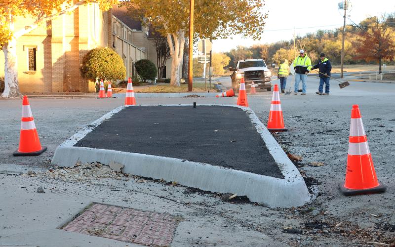 (THOMAS WALLNER | THE GRAHAM LEADER) An extended curb at Third and Cherry Street where a stop sign will be placed as part of redesign to make the intersection a four-way stop. Work is underway to complete that project with city of Graham crews.
