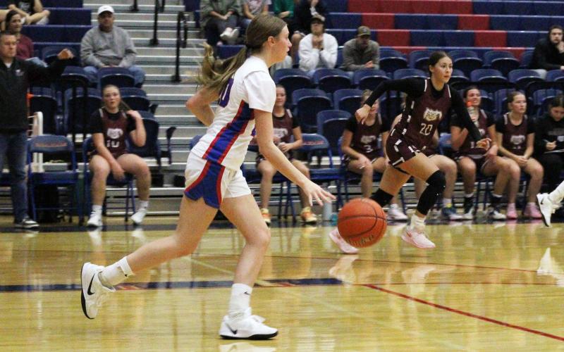 (ALEX HAVARDANSKY | THE GRAHAM LEADER) Katy McGehee takes the ball up court for the Lady Blues in their matchup Thursday, Nov. 20. McGehee led the team in scoring during the Lady Blues’ second matchup of the Bowie tournament Monday, Nov. 24 against the Muenster Lady Hornets.