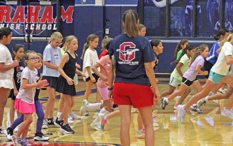 (ALEX HAVARDANSKY | THE GRAHAM LEADER) Lady Blues campers participate in morning warm ups for basketball camp Tuesday, June 3. Lady Blues basketball camp was held from Monday to Wednesday, June 2-4.
