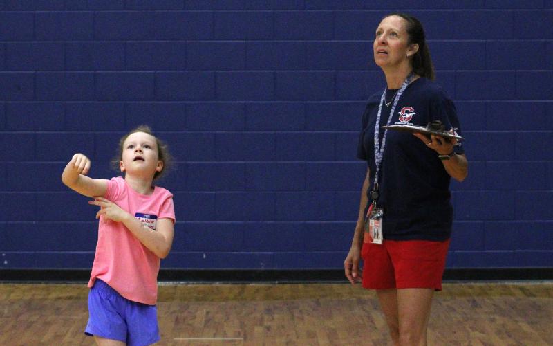 (ALEX HAVARDANSKY | THE GRAHAM LEADER) Lady Blues coaches play around the world with campers Tuesday, June 3. Games like these were meant to help campers fall in love with the game of basketball.