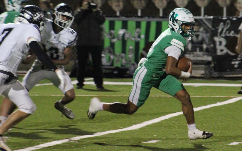 (ALEX HAVARDANKSY | THE GRAHAM LEADER) London Martinez runs a ball up the middle Friday, Nov. 21 against the Water Valley Wildcats. Martinez was one of the veteran leaders of this Bobcats team as a senior.