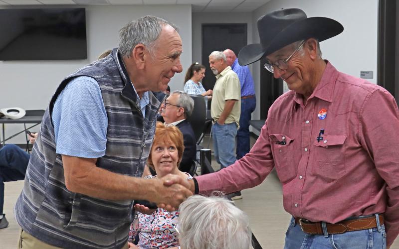 (THOMAS WALLNER | THE GRAHAM LEADER) County judge candidate Donald Sexton shakes hands with opponent John Bullock after the Republican primary results were released Tuesday, March 3. 