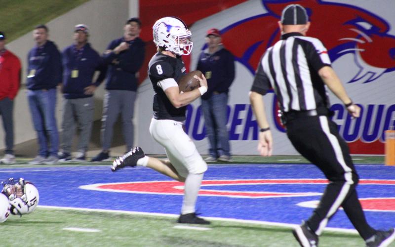 (ALEX HAVARDANKSY | THE GRAHAM LEADER) Jace Gill races away from defenders into the endzone Friday, Nov. 21 against the Lubbock Cooper Liberty Patriots. This score helped Graham get back in the game, tying the score at 21.