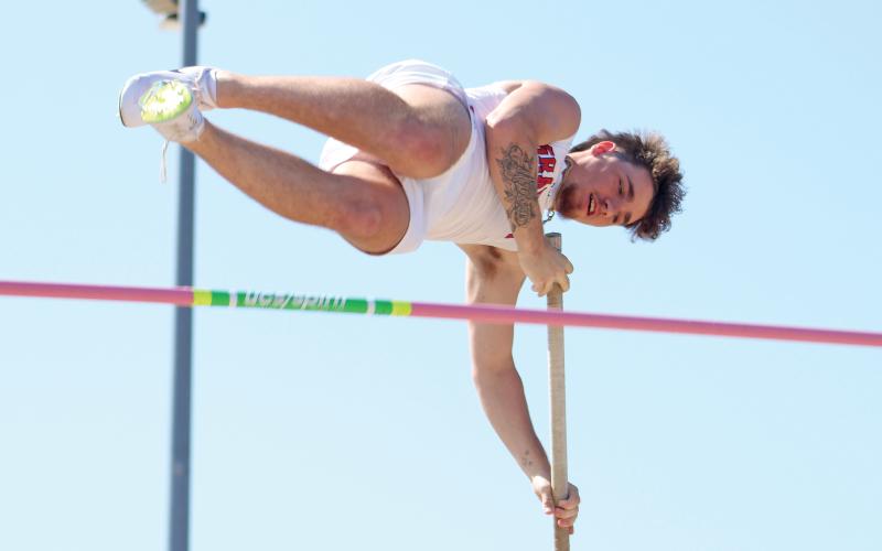 (ALEX HAVARDANSKY | THE GRAHAM LEADER) Rylan Monsley soars during the pole vault event at the area meet Friday, April 11. Monsey finished fourth in the event and will advance to regionals. 