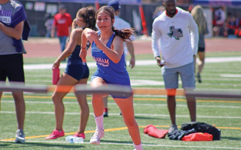 (ALEX HAVARDANSKY | THE GRAHAM LEADER) Emerie Stogner takes off in women’s high jump at the area meet Friday, April 11. Stogner advanced to regionals placing third in the event.