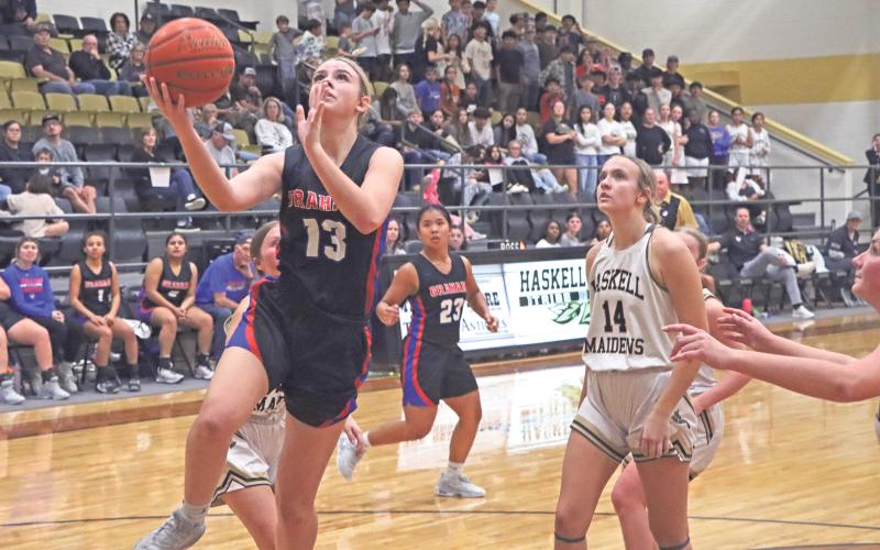 (ARCHIVE PHOTO | THE GRAHAM LEADER) The Lady Blues’ Fayth Bryer elevates for a wide open layup past Haskell’s defense earlier in the season. The Lady Blues won three of four games at a tournament last weekend in Haskell.