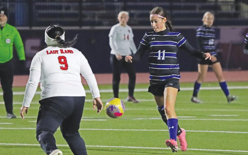 (THOMAS WALLNER | THE GRAHAM LEADER) Marisa Bueno passes the ball up the field during the rematch of the Lady Blues and Mineral Wells Lady Rams held Tuesday, March 4.