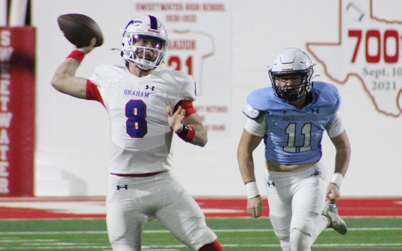 (ALEX HAVARDANSKY | THE GRAHAM LEADER) Jace Gill throws a pass Friday, Nov. 28 in the regional semifinal round of the playoffs. The football team will be one of several teams honored at the fall sports banquet for Graham. 