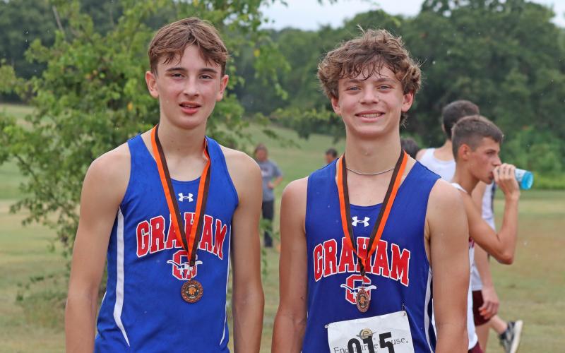 (KYLIE BAILEY | THE GRAHAM LEADER) Nolan Wankowicz, left, and Hudson Weatherman finished in 6th place Wednesday, Aug. 20 in the Nocona CC Relays.