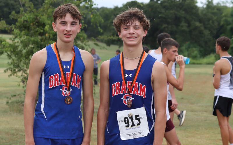 (ALEX HAVARDANSKY | THE GRAHAM LEADER) Nolan Wankowicz, left, and Hudson Weatherman, right, pose for a picture after one of their cross country meets in the fall. The cross country team will be one of several teams honored at the fall sports banquet for Graham. 