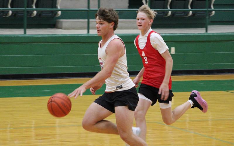 (ALEX HAVARDANSKY | THE GRAHAM LEADER) Cooper Corley races down court for a transition layup Tuesday, June 3 against the Albany Lions. Corley clinched the game after sinking a clutch free throw to pick up a 33-32 Steers win.