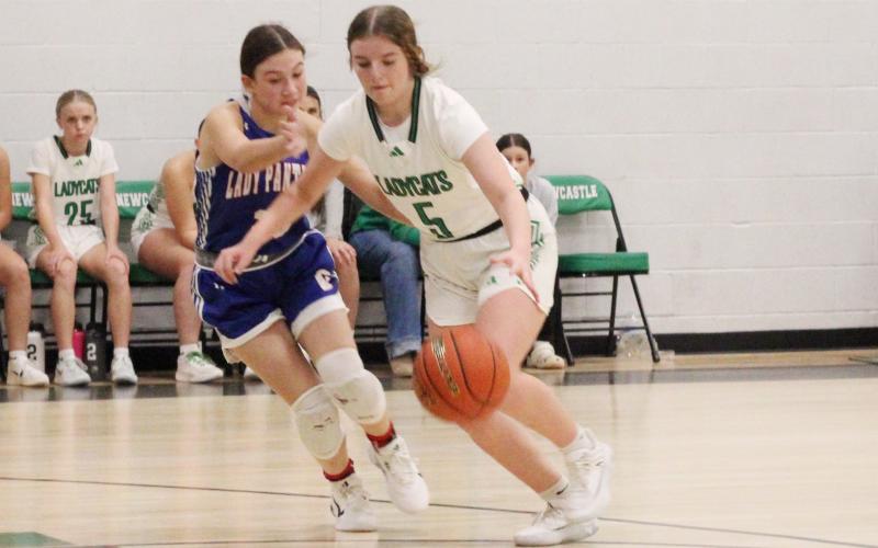 (ALEX HAVARDANSKY | THE GRAHAM LEADER) Kinzlee Sweat drives past a defender in one of the Ladycats’ previous matchups. The Ladycats defeated Wellman Union 42-24 during a tournament in Whiteface from Thursday, Dec. 4 to Saturday Dec. 6. 