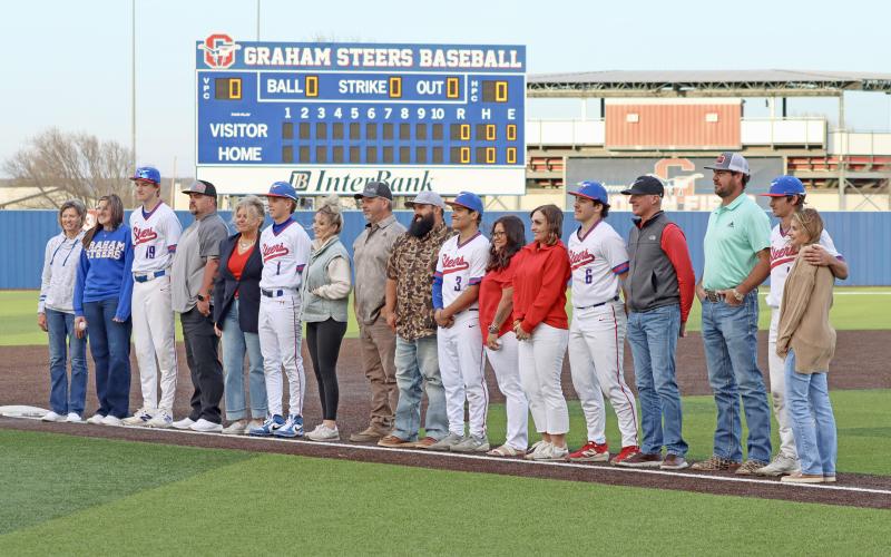(THOMAS WALLNER | THE GRAHAM LEADER) Senior Steers were honored before the Tuesday, March 17 game against Jim Ned. The athletes walked onto the field with their parents and guardians and were recognized by the community. 