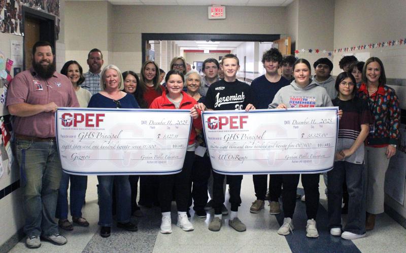 (ALEX HAVARDANSKY | THE GRAHAM LEADER) Two grants for the Gizmos and UT OnRamps programs were presented to Graham High School by the Graham Public Education Foundation during their prize patrol distribution Thursday, Dec. 11.