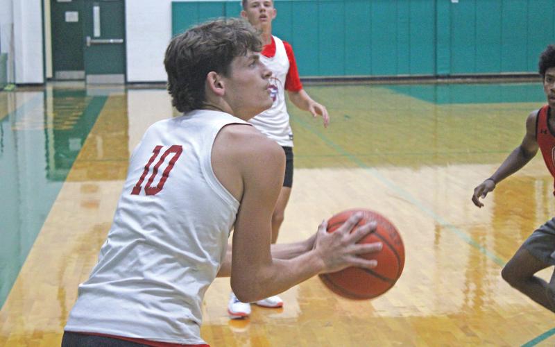 (ALEX KIELAR | BRECKENRIDGE AMERICAN) Brodie Martin attempts a three from the right corner Tuesday, June 10 against the Olney Cubs. Martin and his brother Bryce, were focal points of the offense alongside Cooper Corley according to coach Corley.