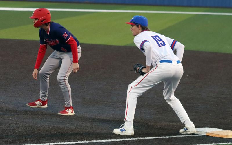 (THOMAS WALLNER | THE GRAHAM LEADER) Senior Jaden Neal watches at first base during the matchup Tuesday, March 17 against the Jim Ned Indians. Neal was one of five seniors who were recognized during the senior night game.