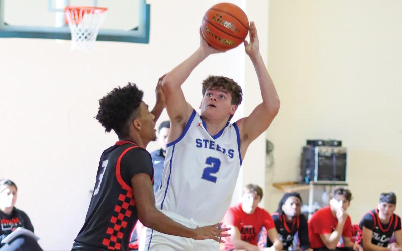 (THOMAS WALLNER | THE GRAHAM LEADER) A Levelland Lobos defender blocks Steers sophomore Bryce Martin during the final day of the Red, White & Blue Tournament in Graham.