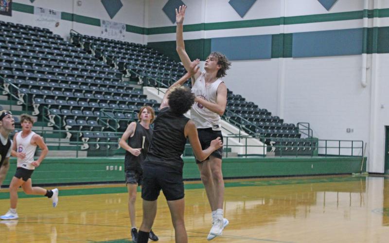 (ALEX KIELAR | THE GRAHAM LEADER) Nick Wankowicz puts up a hook shot from the free throw line Tuesday, June 24, over a Clyde defender as the Graham Steers won this game, 41-29, and their second game, 29-25, to close out the summer basketball league that was hosted in Breckenridge.
