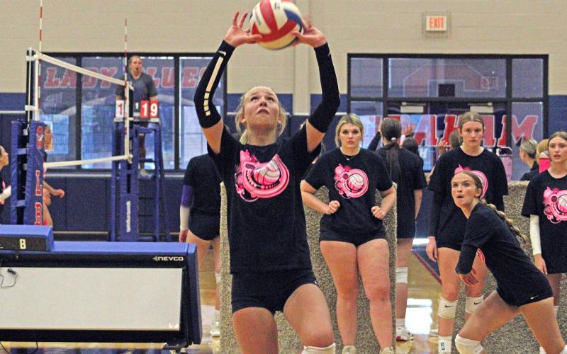 (ALEX HAVARDANSKY | THE GRAHAM LEADER) Kya Cooper sets up a pass for a kill attempt Monday, June 9 against the Woodson Lady Cowboys. Cooper was a promising facilitator and defensive presence Monday night.  