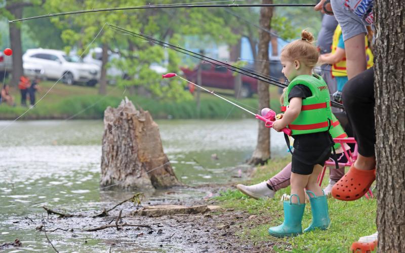 (ARCHIVE PHOTO | THE GRAHAM LEADER) Children fish along the shore of the duck pond at Firemen’s Park during the Family Fun and Fishing event in 2024 at Firemen’s Park. The event this year was postponed from April and will be held Saturday, Oct. 25 at Firemen’s Park.