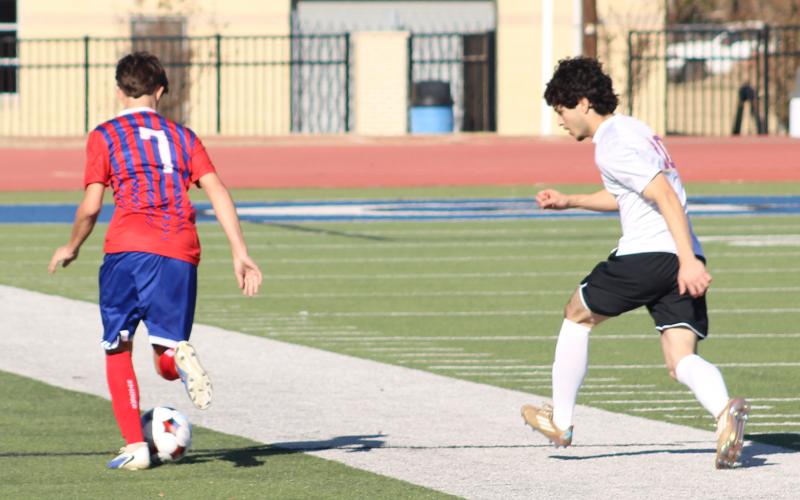 (ALEX HAVARDANSKY | THE GRAHAM LEADER) Pablo Gonzalez drives the ball down field Friday, Dec. 12 against Sanger. The Steers tied the Indians in their matchup by a final score of 1-1. 