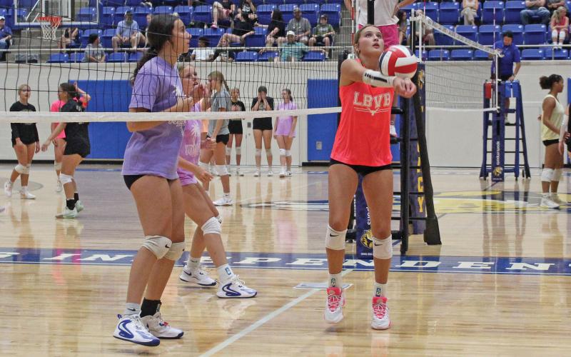 (ALEX HAVARDANSKY | THE GRAHAM LEADER) Emily Hughes sets a pass for the Lady Blues in their match Thursday, July 24. Hughes and her sister, Kathryn Hughes, look to be a pivotal part of the Lady Blues this season.