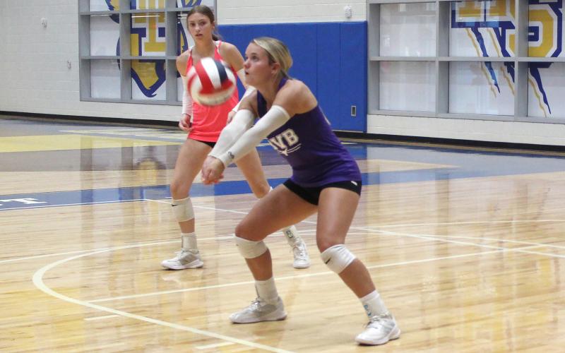 (ALEX HAVARDANSKY | THE GRAHAM LEADER) Kaden Atwood defends a serve attempt Thursday, July 24, by Windthorst. Atwood has been a solid defensive presence for the team and made an impact at the service line for the Lady Blues in this matchup.