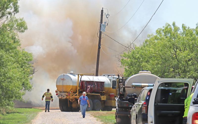 (ARCHIVE PHOTO | THE GRAHAM LEADER) Young County volunteer fire department units arrive to help contain a structure  fire in June 2024. Due to current conditions in the state, Young County Judge Win Graham enacted a burn ban Monday, March 3.