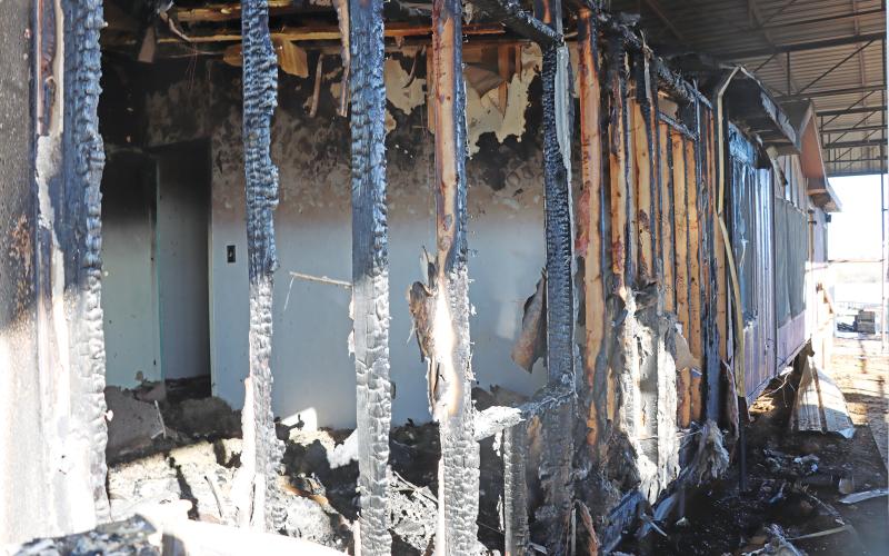 (THOMAS WALLNER | THE GRAHAM LEADER) A portion of a mobile home that caught on fire with hay early Monday, Dec. 3 at the Red Orchard Animal Rescue Foundation in Loving. The rescue is looking for support after the fire destroyed supplies and hay for the animals at the rescue.