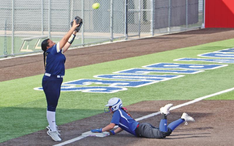 (ALEX HAVARDANSKY | THE GRAHAM LEADER) Hannah Mason of the Lady Blues slides into third base after hustling around second during the Tuesday, March 19 game against Stephenville. The team will travel Tuesday, March 25 to Brock for their next game.