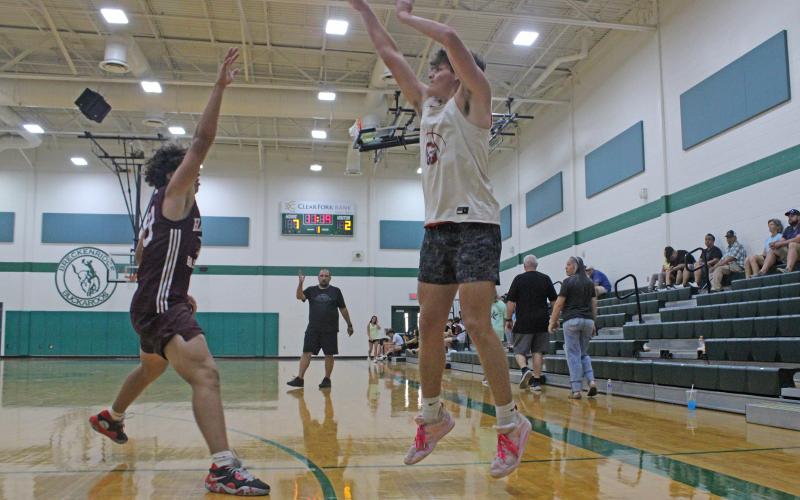 (ALEX KIELAR | THE GRAHAM LEADER) Bryce Martin attempts a three-point shot for the Steers in their game against the Clyde Bulldogs during the final week of the Breckenridge summer basketball league Tuesday, June 24. 