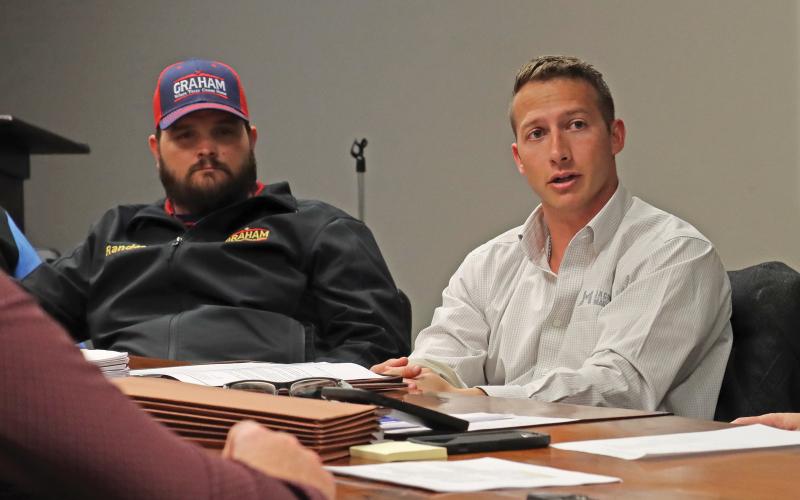(ARCHIVE PHOTO | THE GRAHAM LEADER) Jacob & Martin Project Manager Tristan King (at right) speaks with the Graham Parks Department Board of Directors during a February 2024 meeting. Jacob & Martin was approved to assist with the city with the scope and cost of a lead service line inventory.