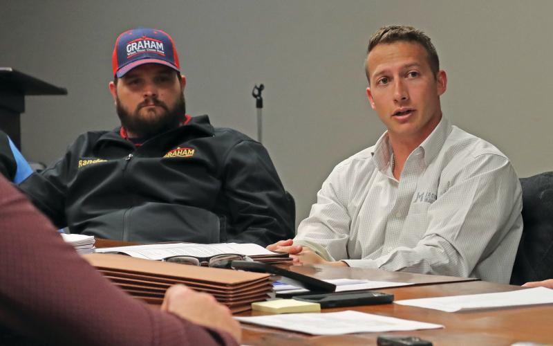 (THOMAS WALLNER | THE GRAHAM LEADER) Jacob and Martin Project Manager Tristan King (right) speaks with the Graham Parks Department Board of Directors during a February 2024 meeting. The company was approved in July to assist the city with the scope and cost of a lead service line inventory.