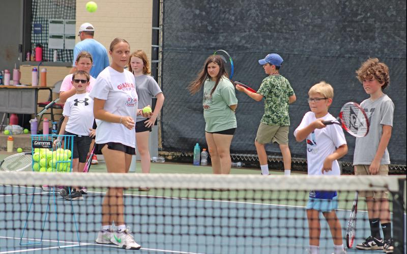 (ALEX HAVARDANSKY | THE GRAHAM LEADER) A young Steers camper successfully hits the ball with proper form at Graham tennis camp Tuesday, June 10.