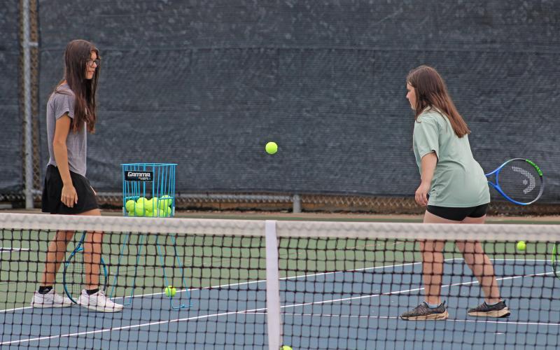 (ALEX HAVARDANSKY | THE GRAHAM LEADER) A Lady Blues camper waits on a ball to swing at Tuesday, June 10 at Graham tennis camp. This camp was about teaching the fundamentals of the sport to students, according to coach Matt Birdwell. 