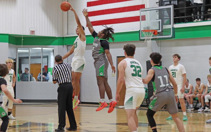 (THOMAS WALLNER | THE GRAHAM LEADER) Jacob Omundi uses his height and jumping ability to his advantage to get possession for the Bobcats during the Friday, Jan. 3 matchup against the Gold-Burg Bears. The Bobcats came away with a 56-48 win on their home court.