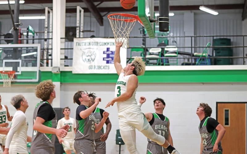 (THOMAS WALLNER | THE GRAHAM LEADER) Keyton Newland runs from behind the basket to layup a shot in a home matchup against Gold-Burg last Friday, Jan. 3. Newland was a dominating force for the team with 16 points on the board overall.